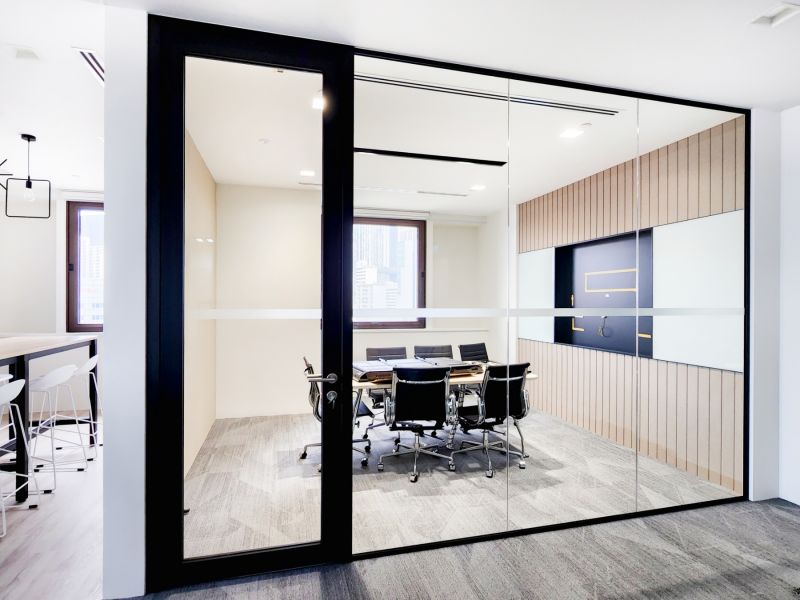 Office Meeting Room with Glass Partition and Framed Door